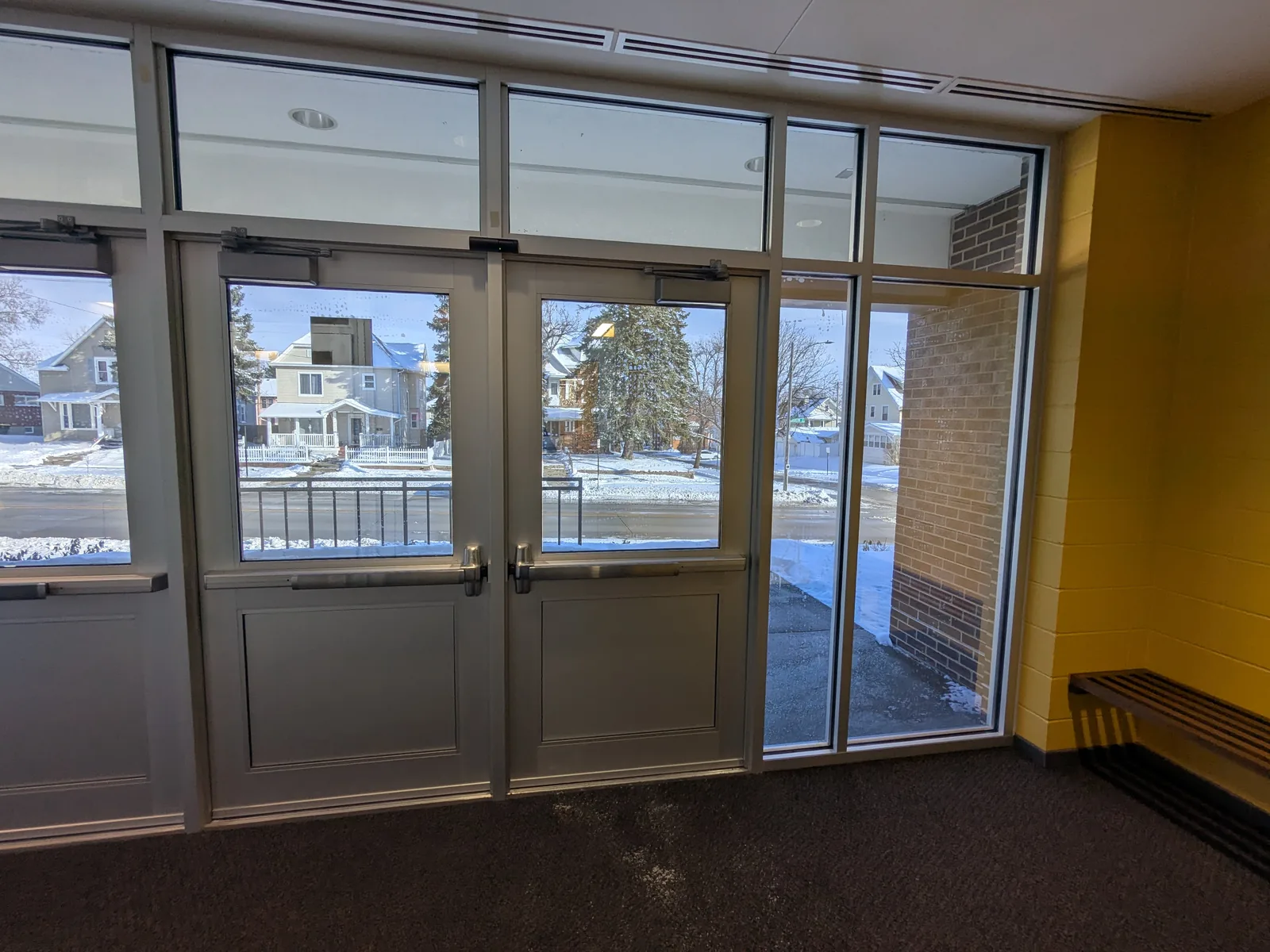 School main entry doors and sidelites with security window film installed