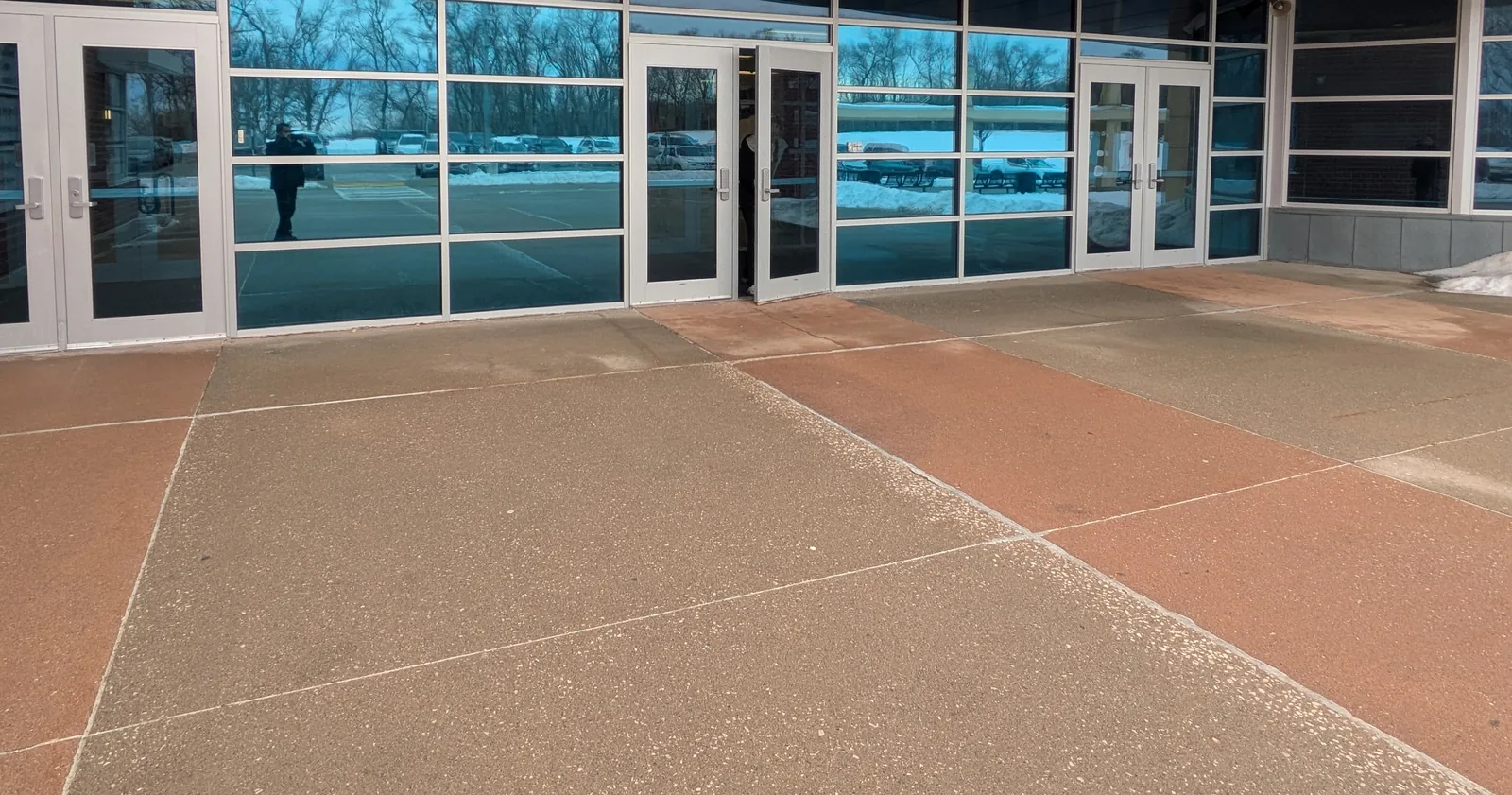 Exterior of a school glass entrance after security window film installation