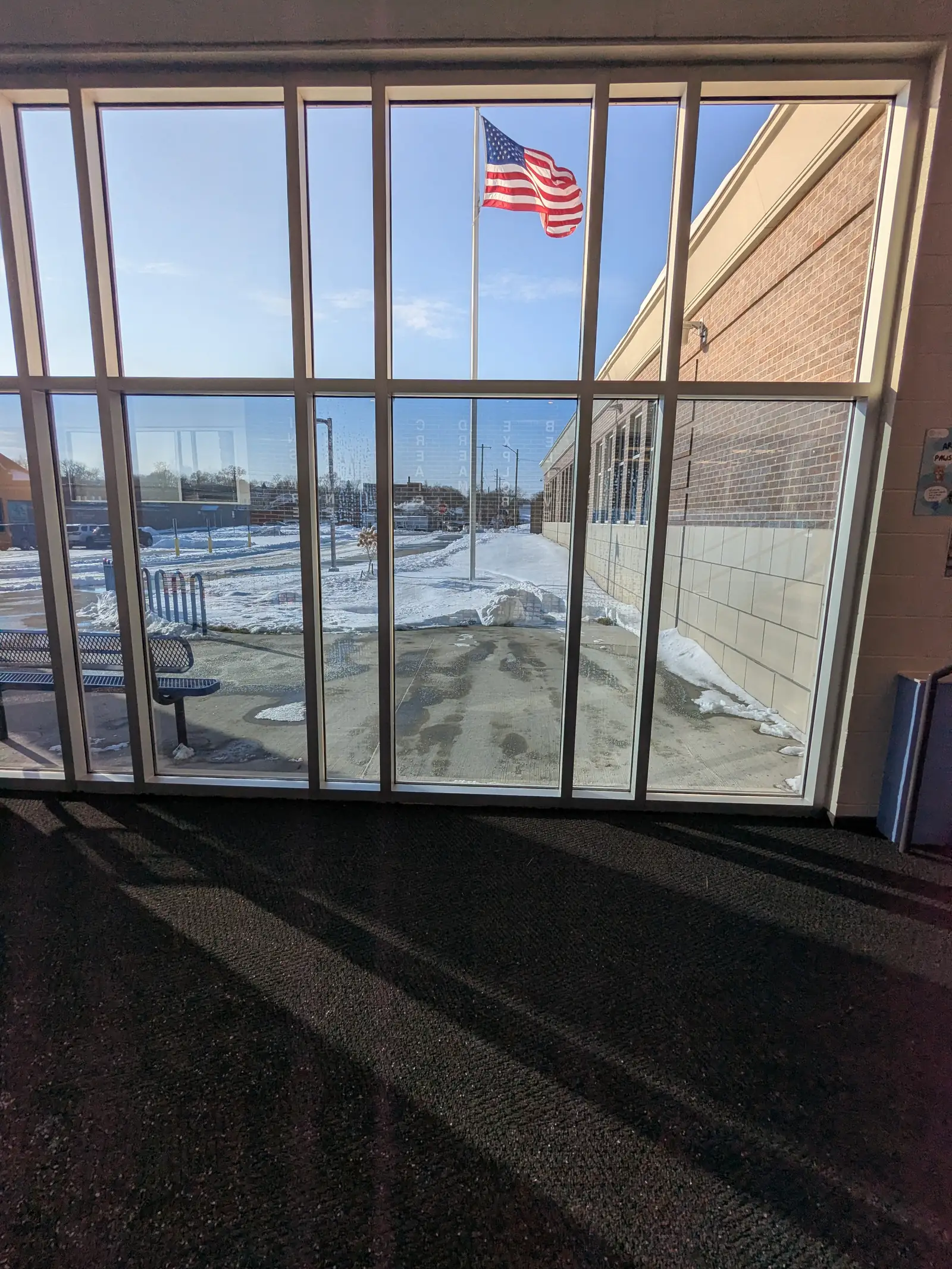 School entrance vestibule glass treated with shatter-resistant security film