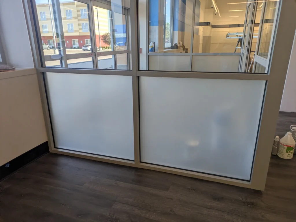 School lobby glass partition with frosted film on the lower panels